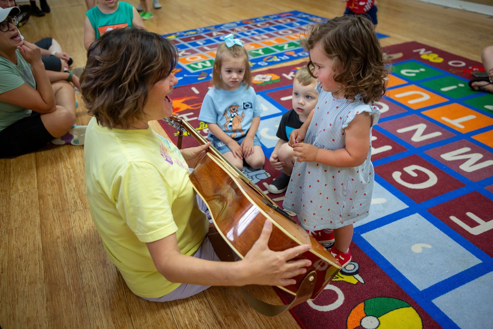 Kids MusicRound teacher sharing music with a young child